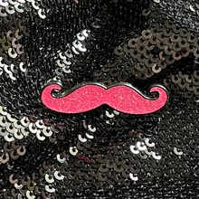 Load image into Gallery viewer, Pink mustache enamel pin by Queen On The Scene. Pink glitter and in the shape of a mustache.

