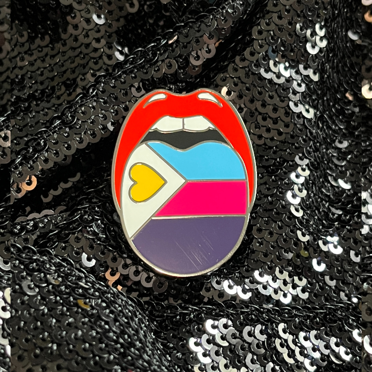 Polyamorous pride flag enamel pin by Queen On The Scene features the poly pride flag.