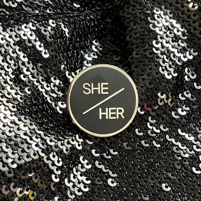She/her pronoun pin from Queen On The Scene.