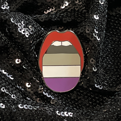 Asexual Pride Flag Pin to show your ace pride. Features the Queen On The Scene tongue design and ACE Pride Flag.