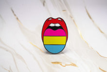 Load image into Gallery viewer, A tongue-and-lips enamel pin featuring the pansexual pride flag colors (red, pink, yellow, and blue) on a white and gold marble background.
