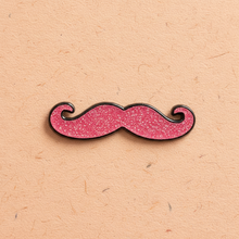 Load image into Gallery viewer, Pink mustache enamel pin by Queen On The Scene. Pink glitter and in the shape of a mustache.
